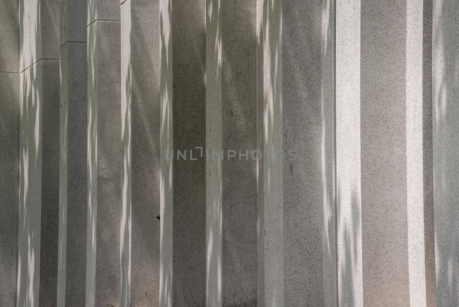 Sunlight passing through the exterior of the concrete building. copy space.