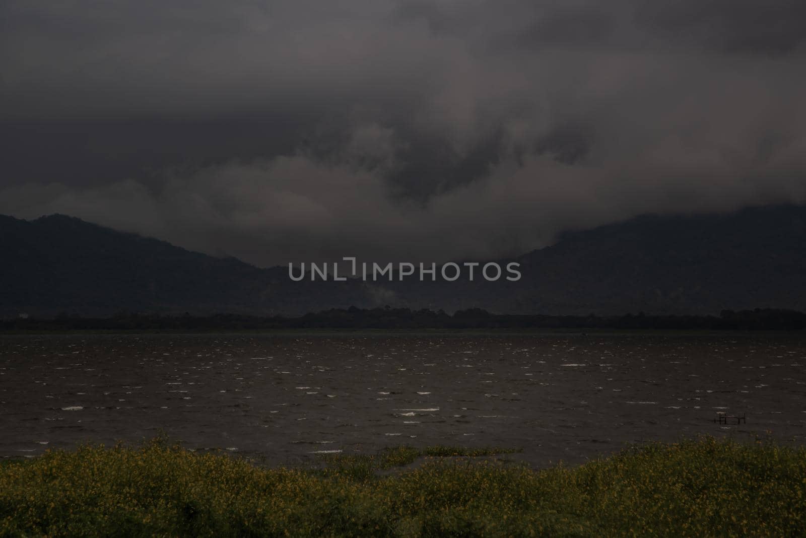 The beauty of Bang Phra Reservoir on the background of misty capped mountains, Chonburi Province, Thailand