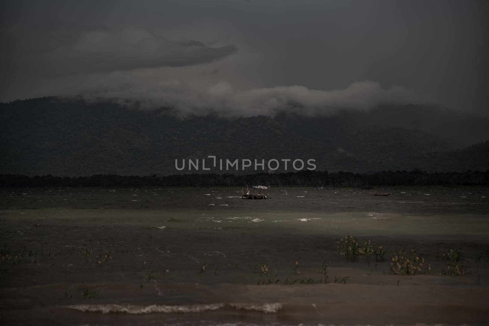 The beauty of Bang Phra Reservoir on the background of misty capped mountains, Chonburi Province, Thailand
