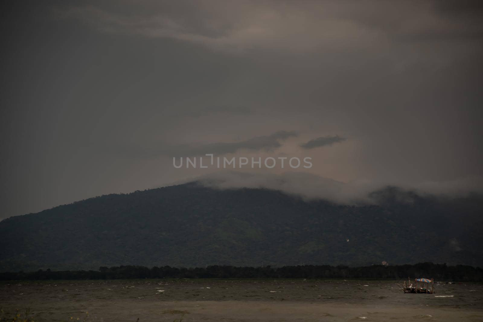 The beauty of Bang Phra Reservoir on the background of misty capped mountains, Chonburi Province, Thailand