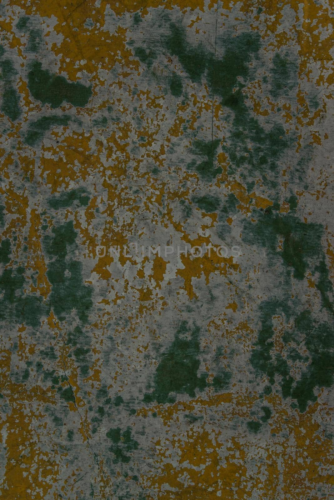 Beautiful patterns on the Old plastered field with falling off flakes of paint. Texture, background, different color patterns, copy space.