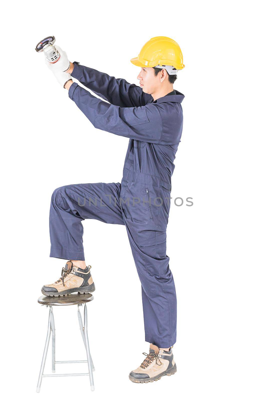 Young handyman in uniform hold grinder, Cutout isolated on white background with clipping path
