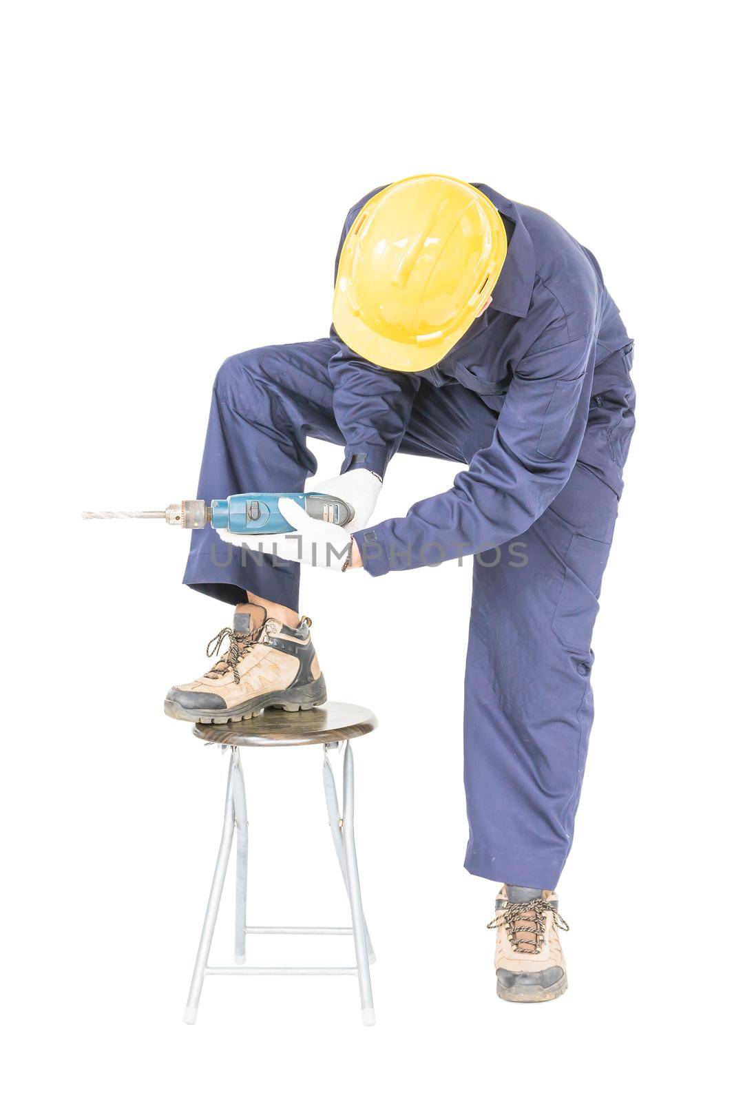 Young handyman in unifrom standing with his electric drill, Cutout isolated on white background