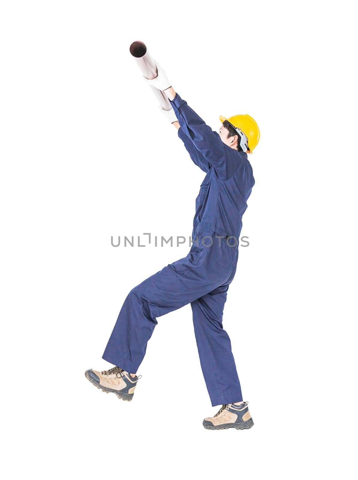 Young plumber in uniform holding pvc pipe isolated on white background