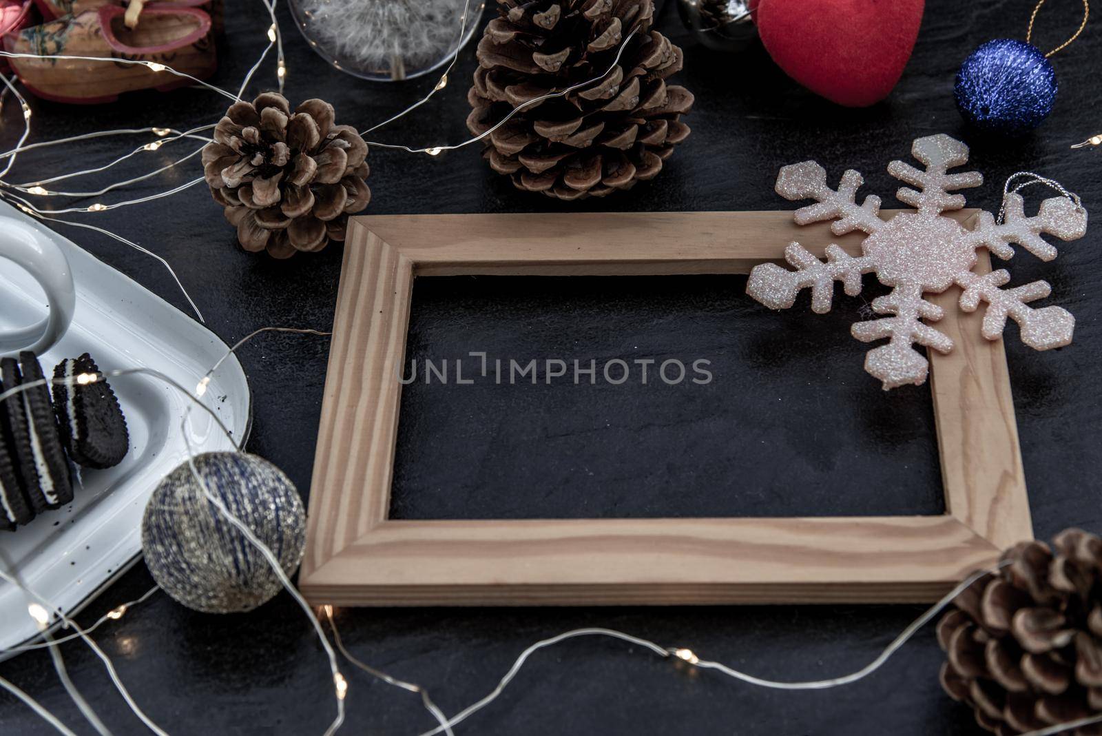 Christmas decoration with Empty wooden frame for work about design element.  Selective focus, Oblique view from the top, copy space