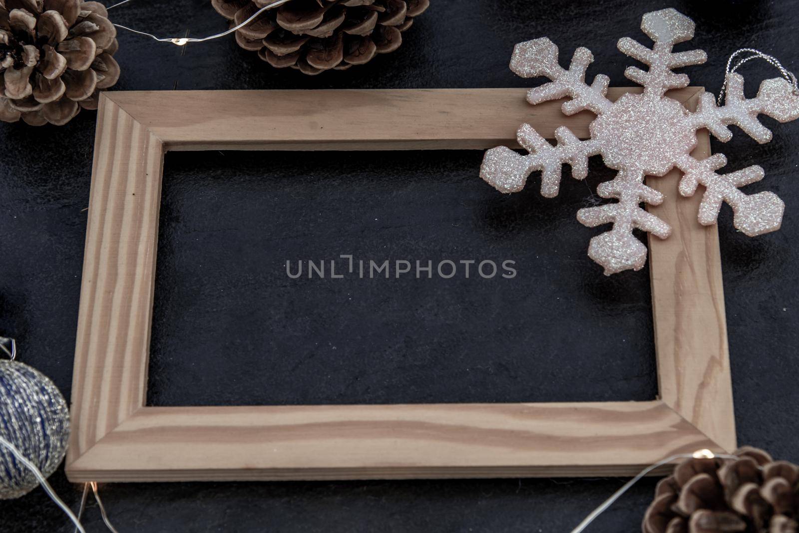 Christmas decoration with Empty wooden frame for work about design element.  Selective focus, Oblique view from the top, copy space