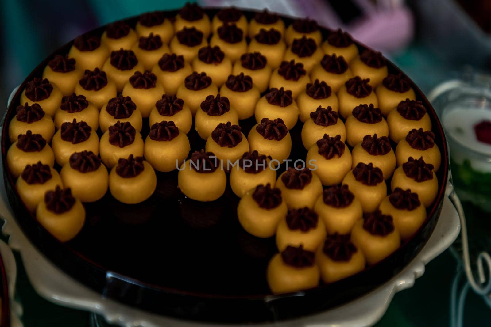Traditional Thai Dessert (Kanom Thai) : Sanay Chan Made from minced coconut mixed with flour, sugar, egg yolk, rice flour and chan herb serving on a wooden background, Oblique view from the top.