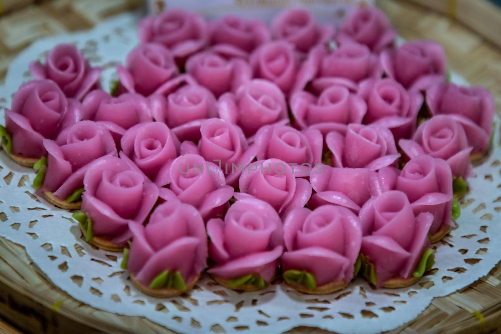 Traditional Thai desserts sweet and delicious : colorful candy with rose shaped. "A-lua or Allure" Thai handmade candy, Selective focus.