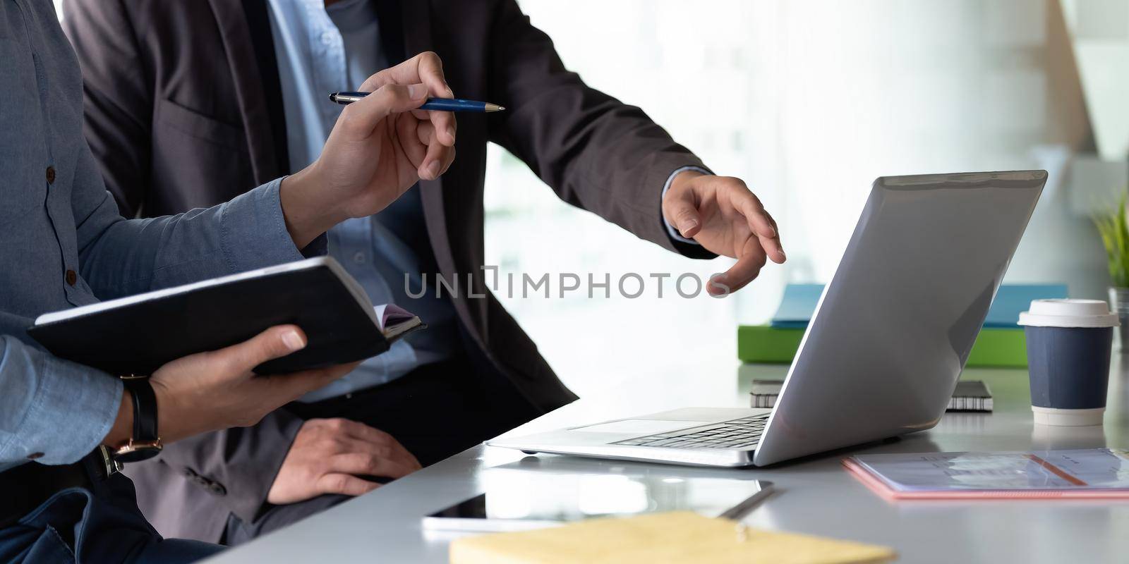 Group of Businesswoman and Accountant checking data document on laptop computer for investigation of corruption account Anti Bribery concept by nateemee