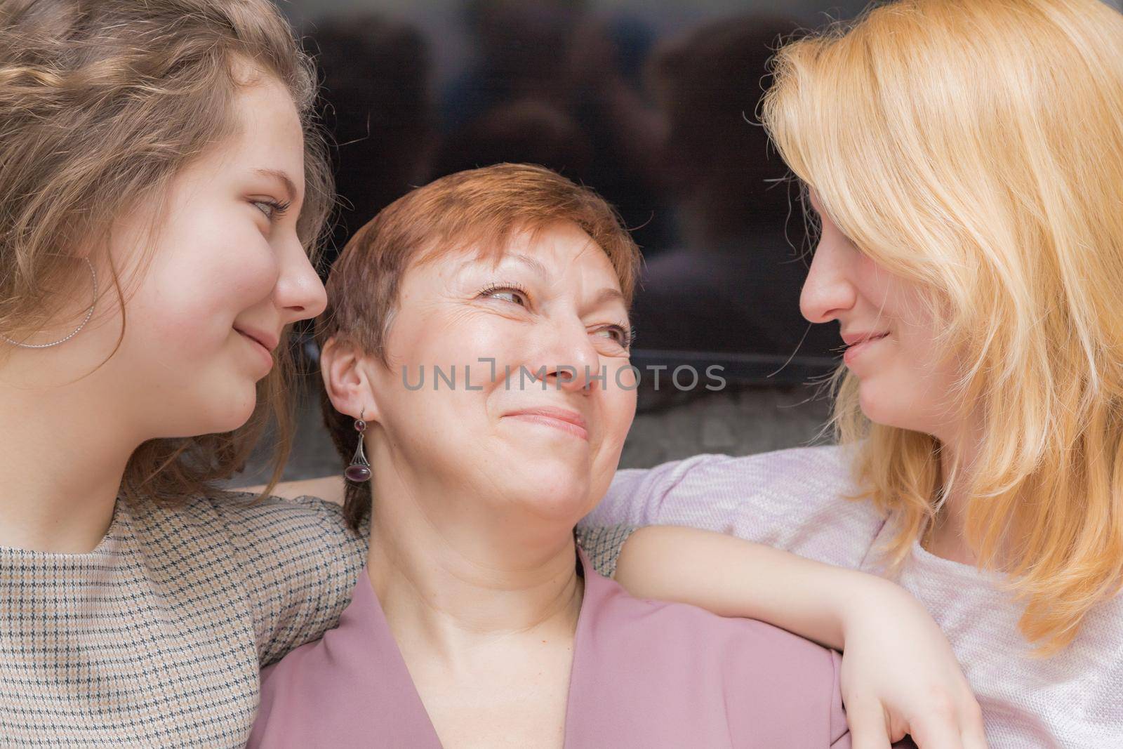 A young girl congratulates her mother on the holiday. by Yurich32