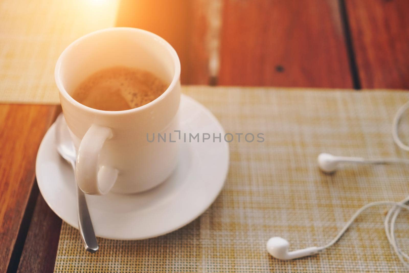 Black coffee or a shot of espresso on wood table background.