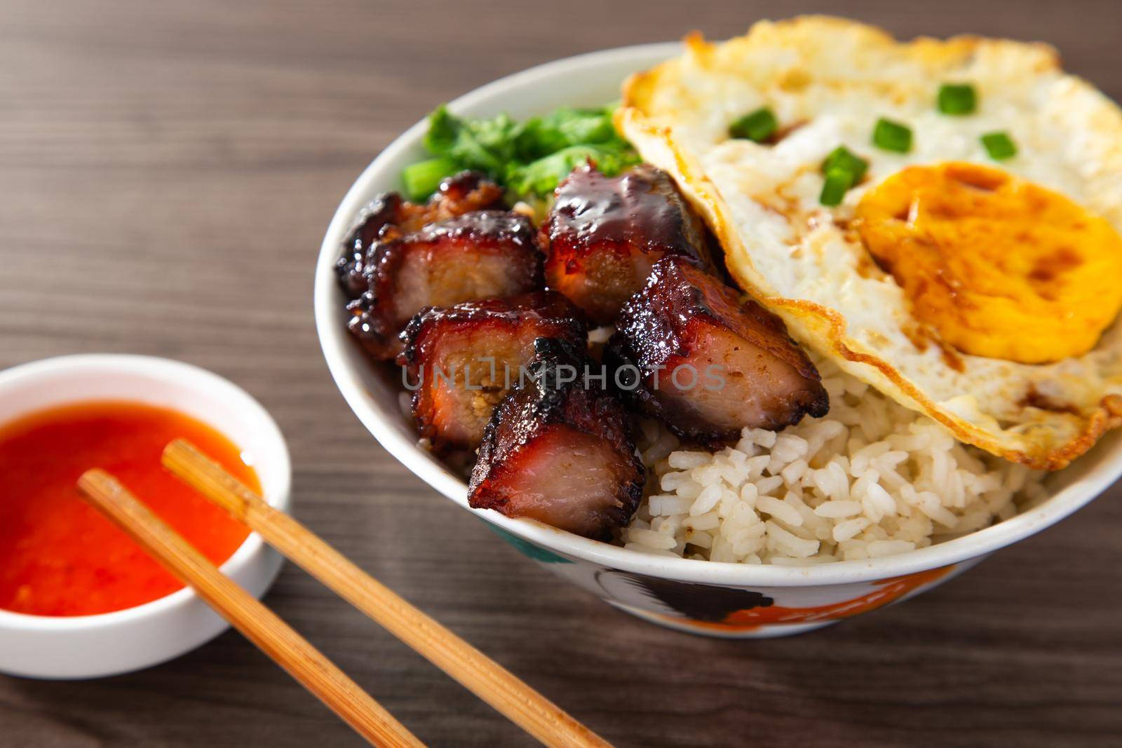 Chinese Sweet Bbq Pork is marinated in a sweet BBQ sauce and served with white rice. by tehcheesiong