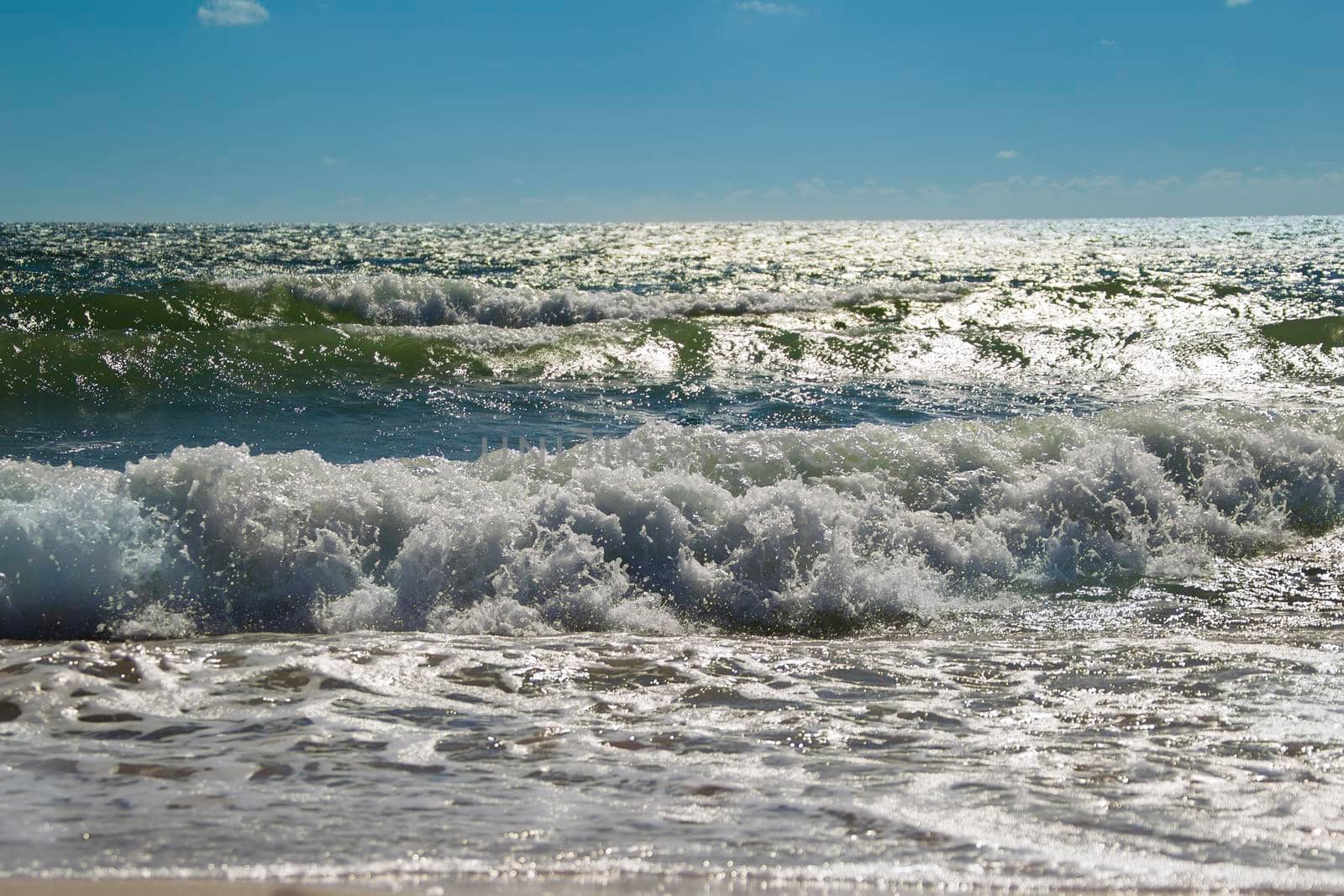 Seascape with clouds in the sky with waves