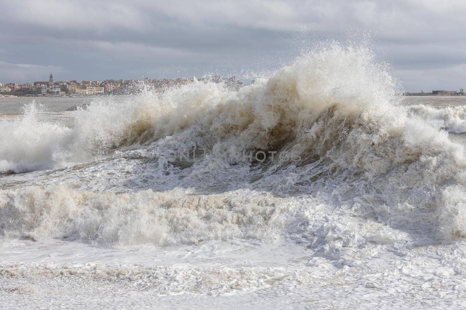 Powerful ocean wave breaking ina windy day by Digoarpi
