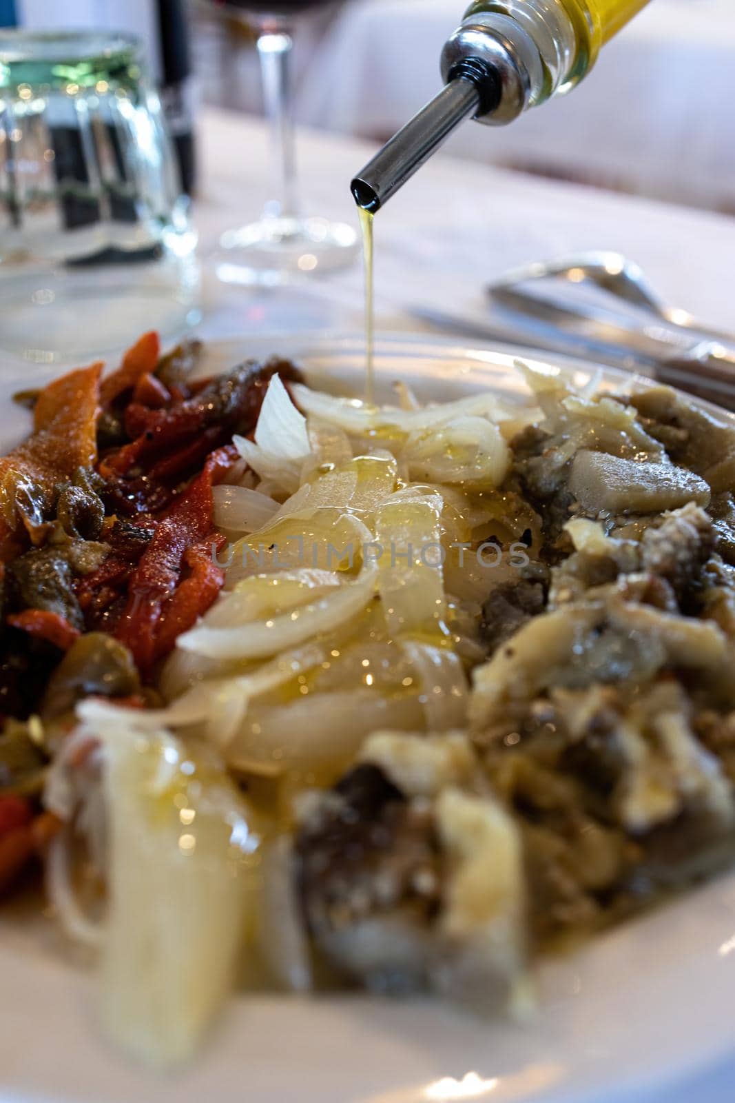 Healthy typical Catalan food in the restaurant, roasted vegetables, its name is escalivada by Digoarpi