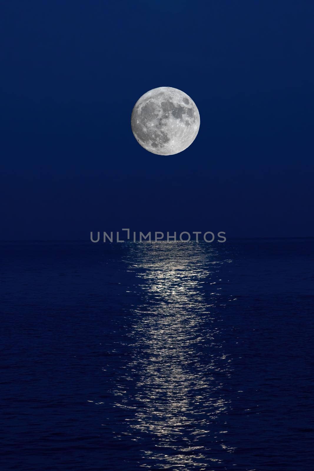 Full moon reflection over the evening sea in Spanish Costa Brava by Digoarpi
