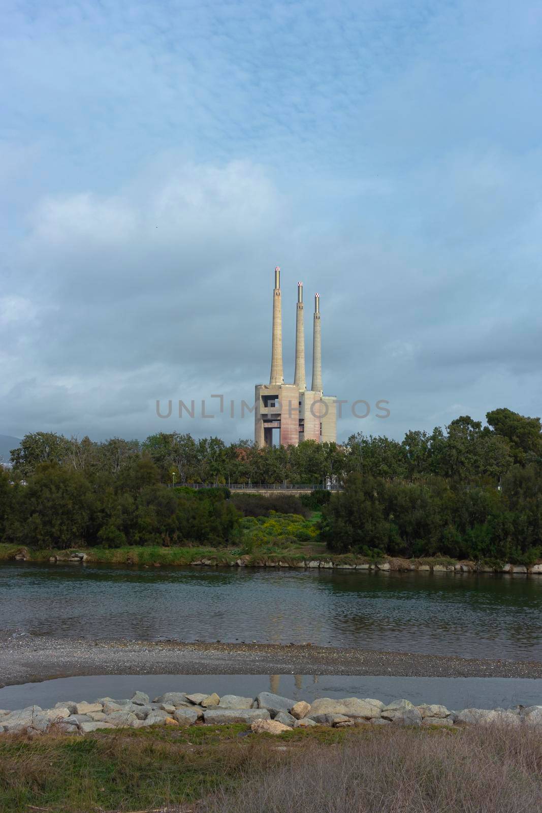 Landscape with an old disused thermal power station for the production of electric energy in Barcelona Spain