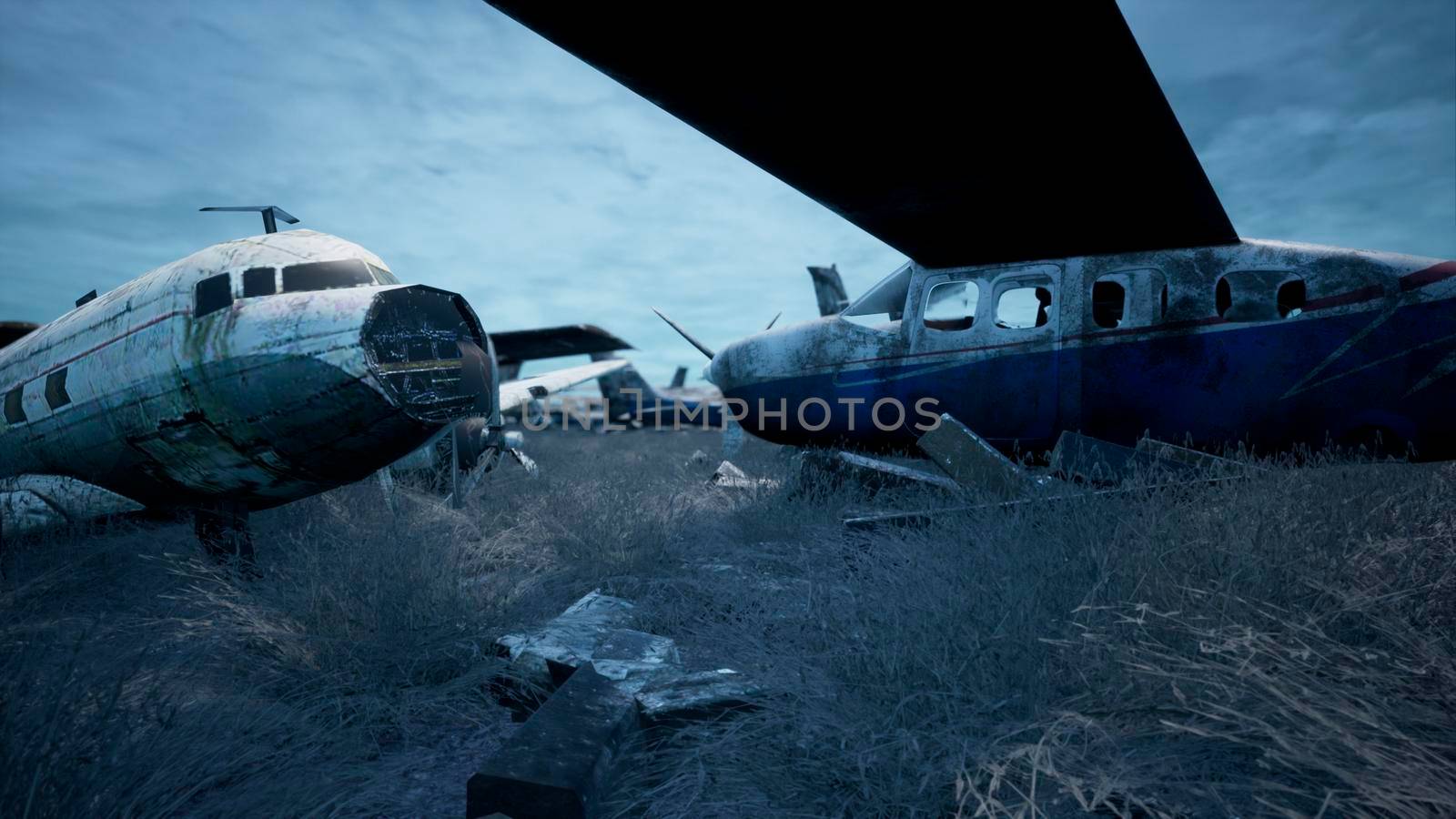 Rusty and broken planes stand in a field against a hazy blue sky. A lot of destroyed, destroyed, abandoned planes. 3D Rendering by designprojects