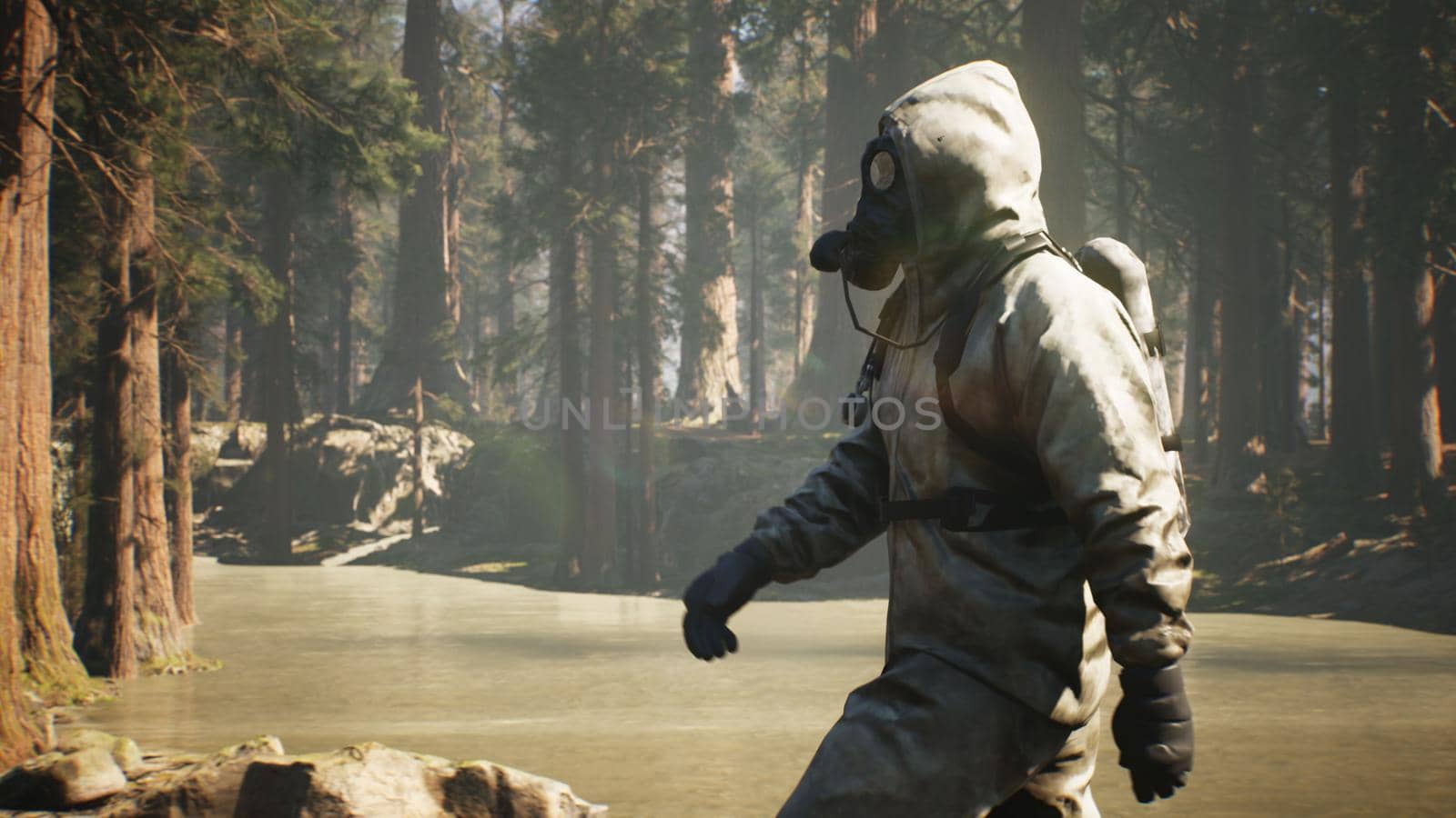 A Stalker in military protective clothing and a gas mask walks through a summer sunny forest. The concept of a post-apocalyptic world after a nuclear war.
