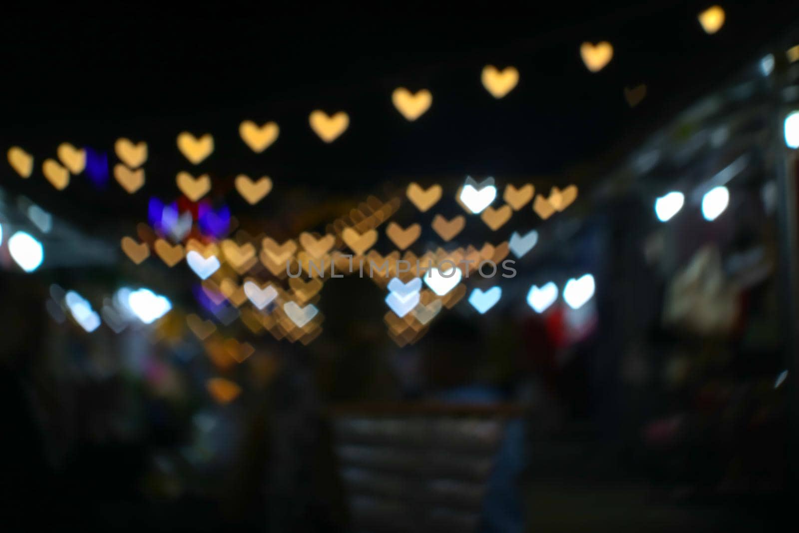 imgae of bokeh and blur line heart shape love valentine day night light in the garden vintage tone