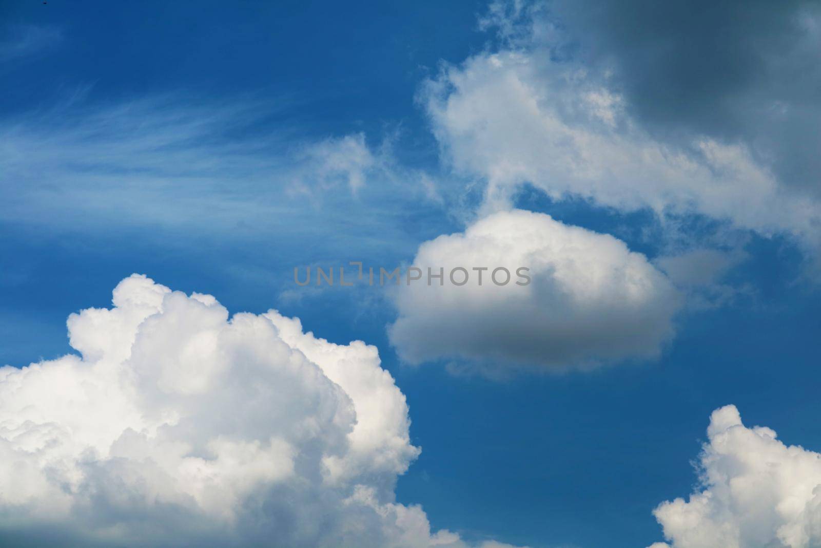 pure heap cloud and sunlight shining and pass on blue sky in summer season