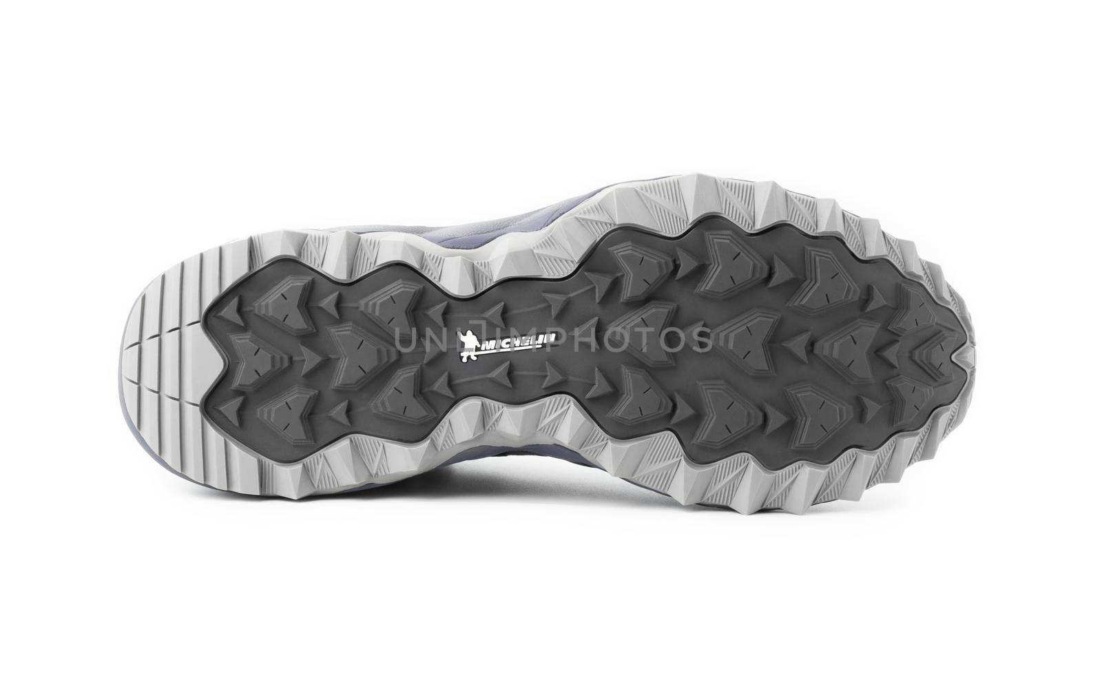 CHISINAU, MOLDOVA - FEBRUARY 25, 2021: Mizuno Wave Mujin 6 Trail running sole of the sneaker, close up isolated on a white. Mizuno Brothers Ltd founded in 1906 by Rihachi and his brother Rizo, Osaka Japan