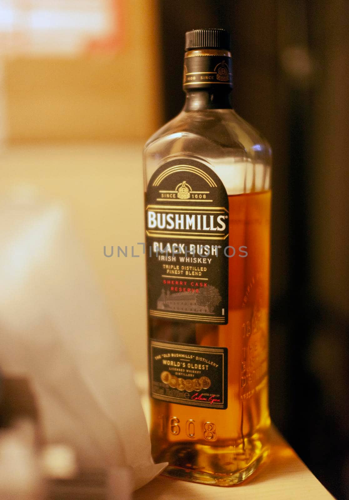 CHISINAU, MOLDOCA - FEBRUARY 19, 2021: Bottle of Bushmills Original Irish whiskey, product of Old Bushmills Distillery founded in 1608, today owned by Casa Cuervo. Concept photo
