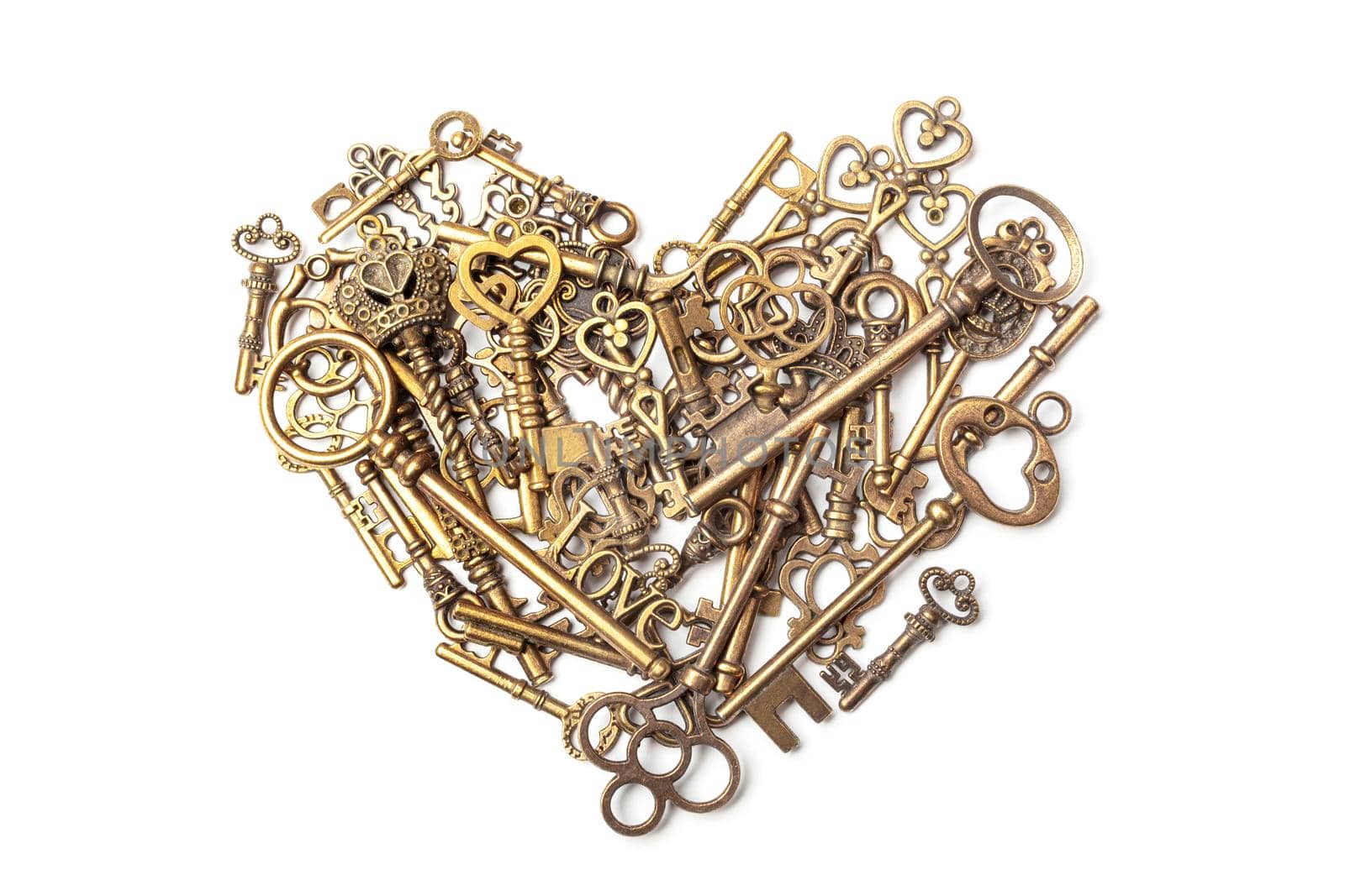 Old, vintage keys in the shape of a heart isolated on white bacground