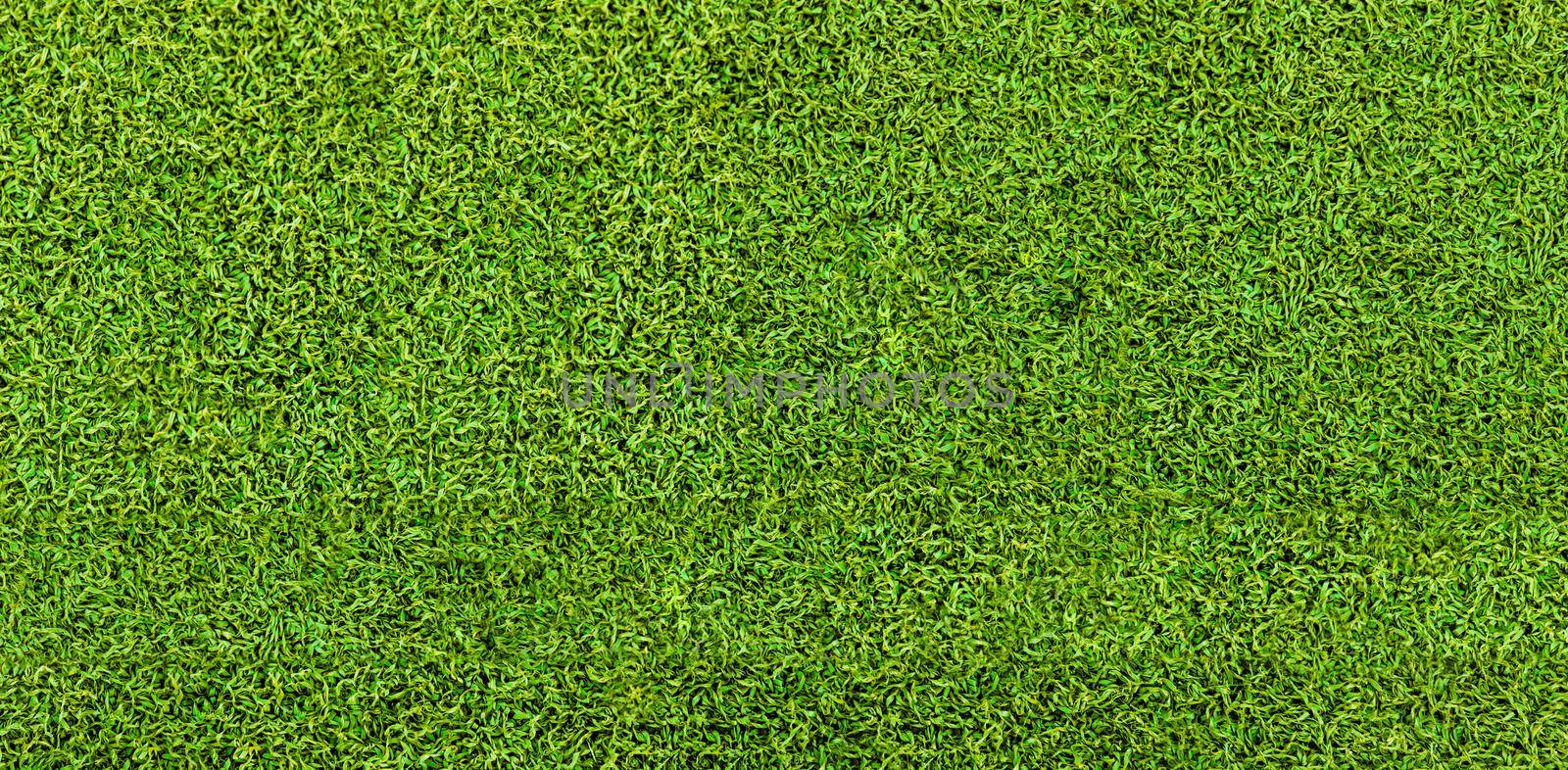 Green grass texture background. Artificial green grass. Top view of bright grass background. Idea concept used for making green backdrop, lawn for a training football pitch, Grass Golf Courses green lawn pattern textured background.
