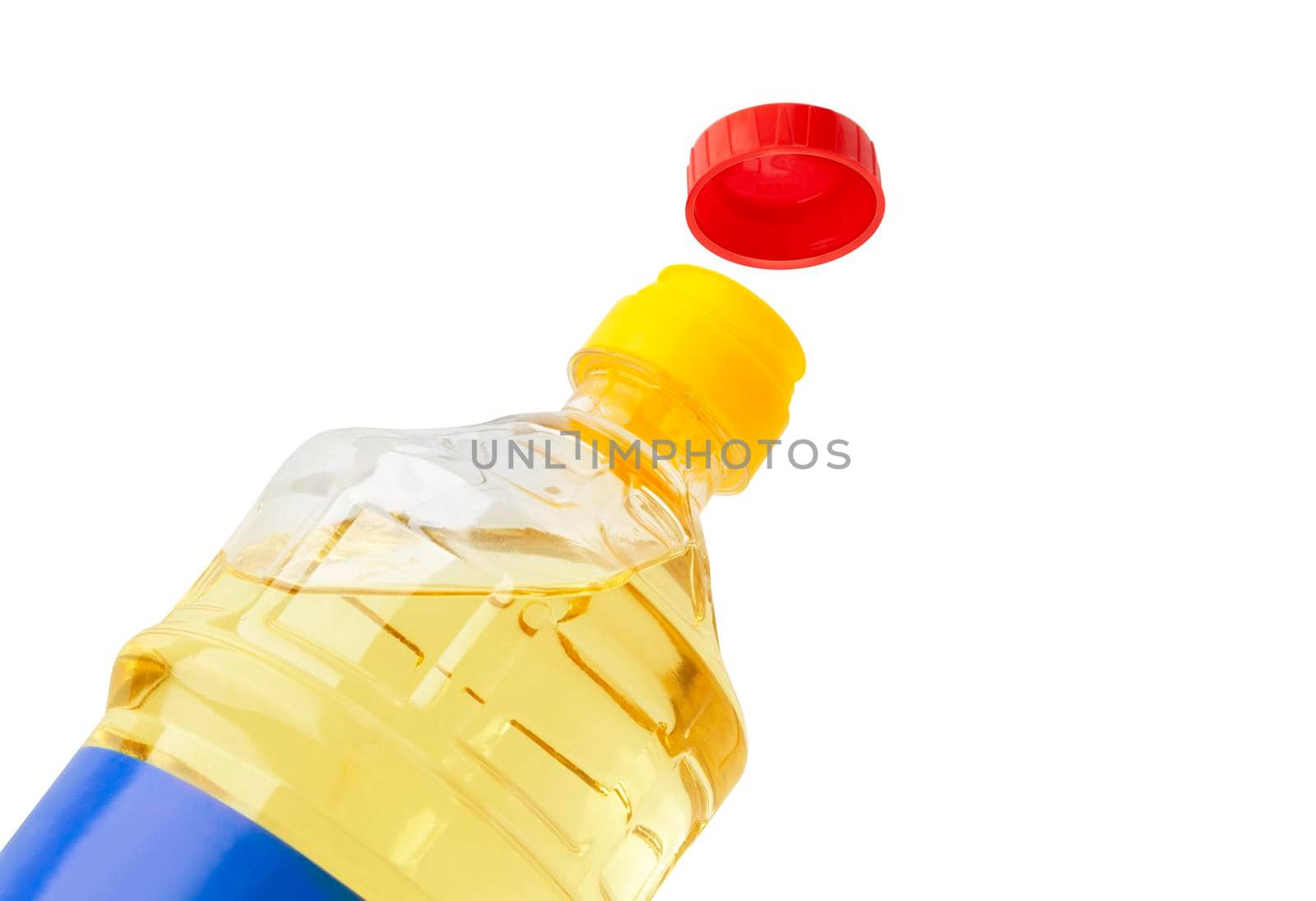 Oil in an opened plastic bottle. Isolated on white background. With clipping path