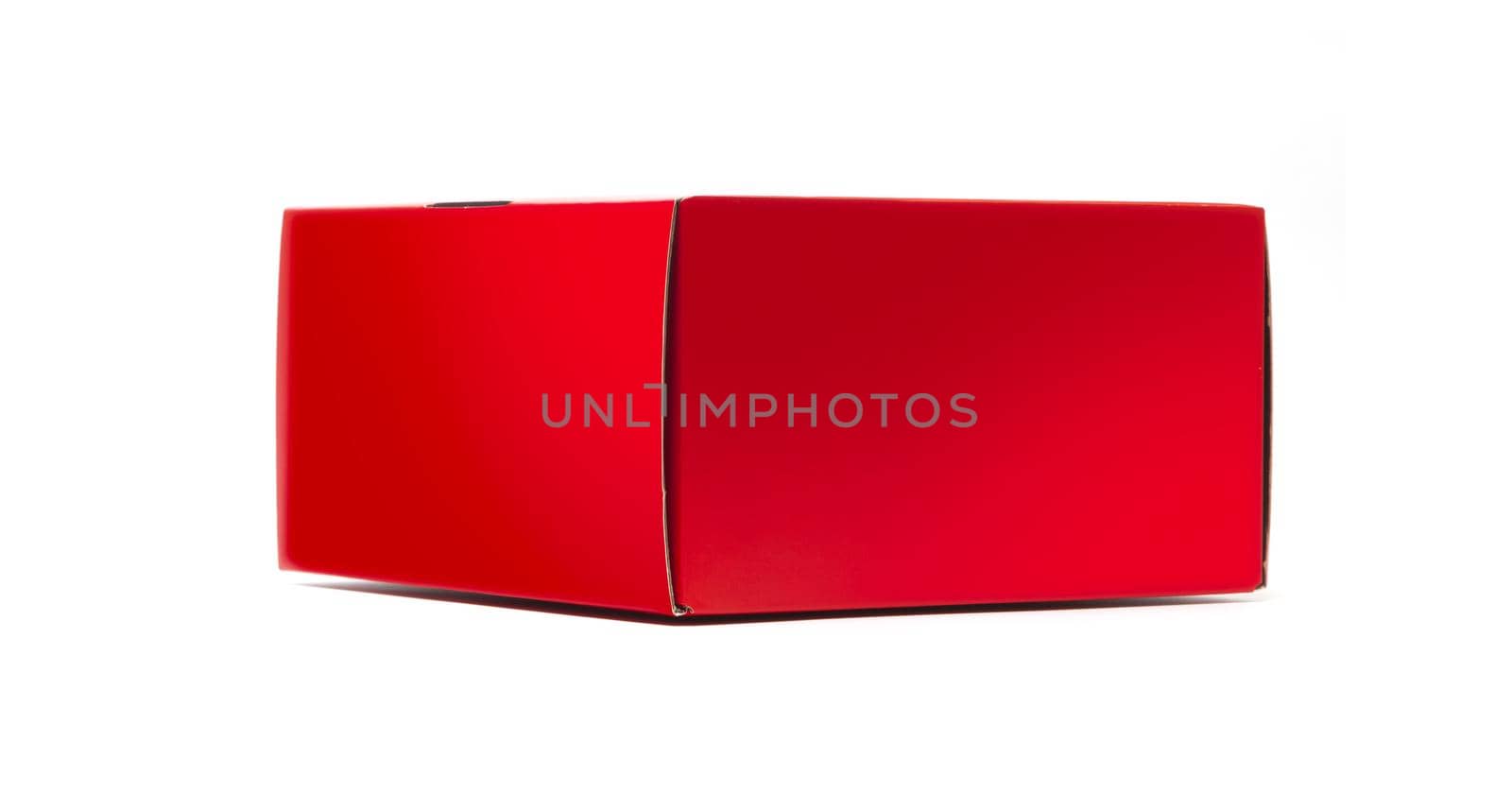 Closed Red cardboard gift box. packaging for shopping and gifts isolated on white background