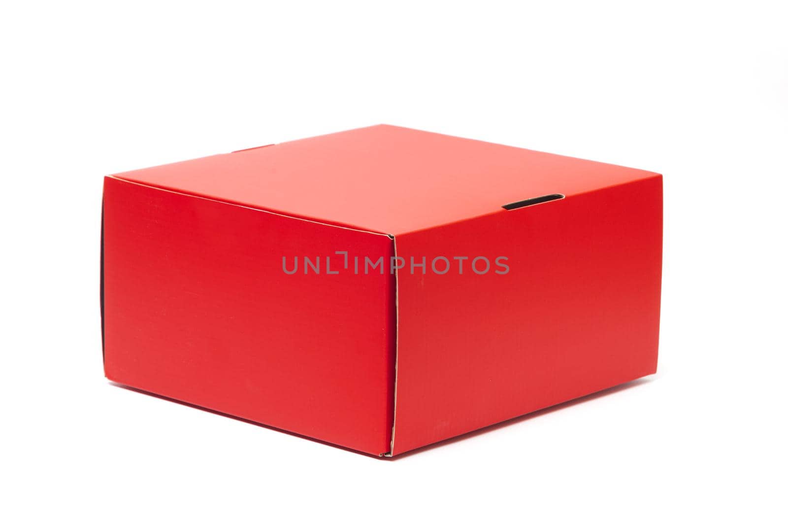 Closed Red cardboard gift box. packaging for shopping and gifts isolated on white background