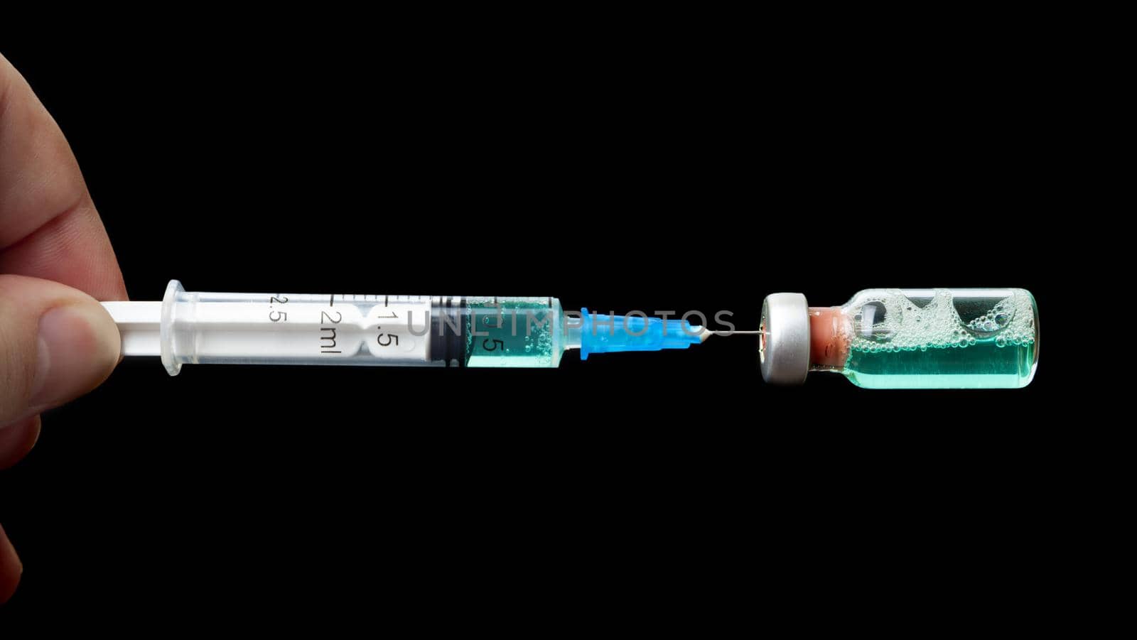 syringe isolated on black background by SlayCer