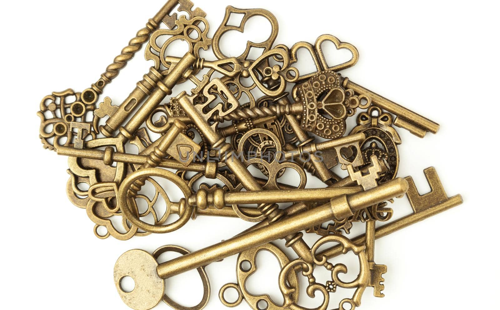 pile of old keys isolated on white background by SlayCer