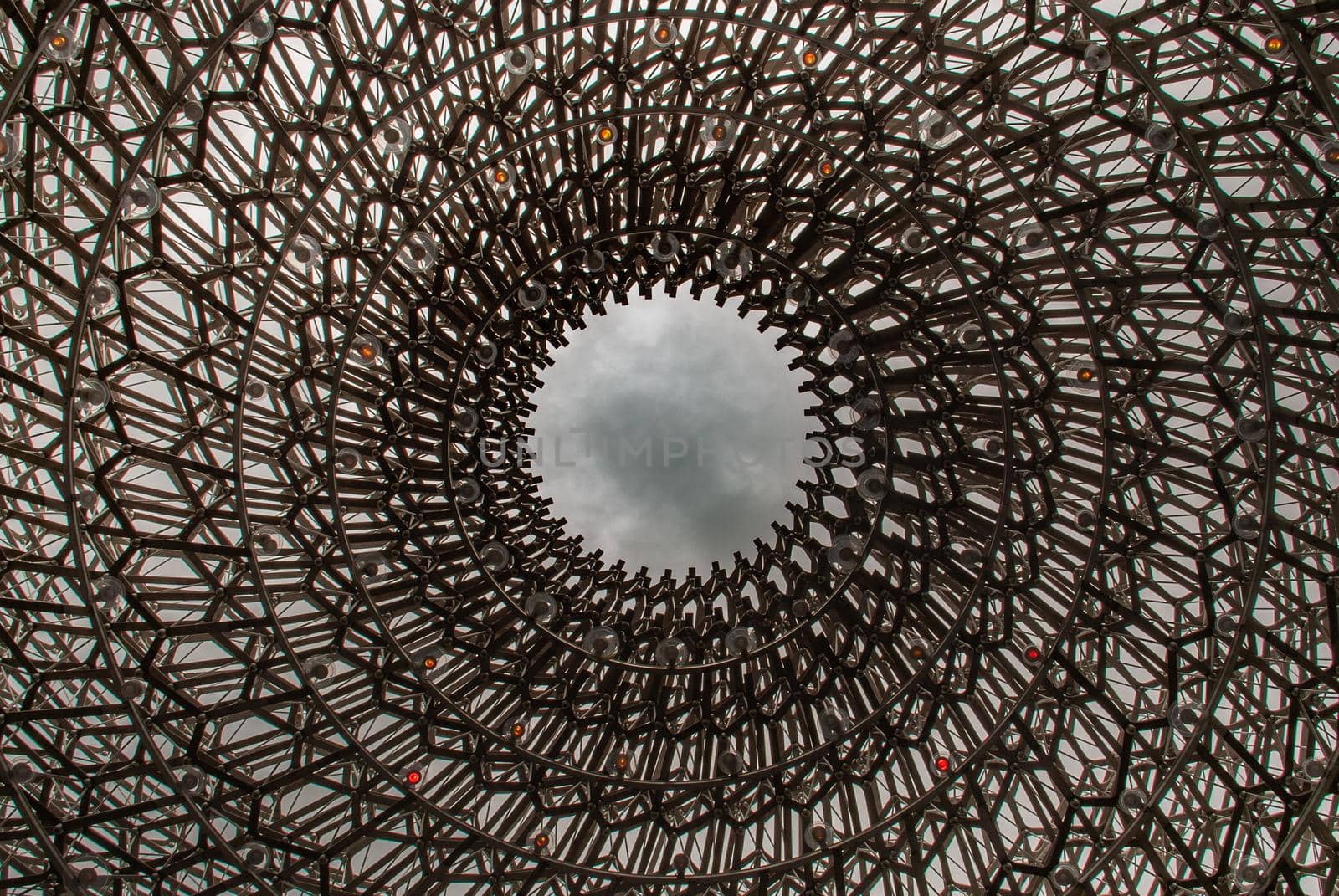 London, UK - Apr 9, 2019 : Detail on the center of the intricate structure under a clear sky, It is called "The Hive" Designed by Artist Wolfgang Buttress.