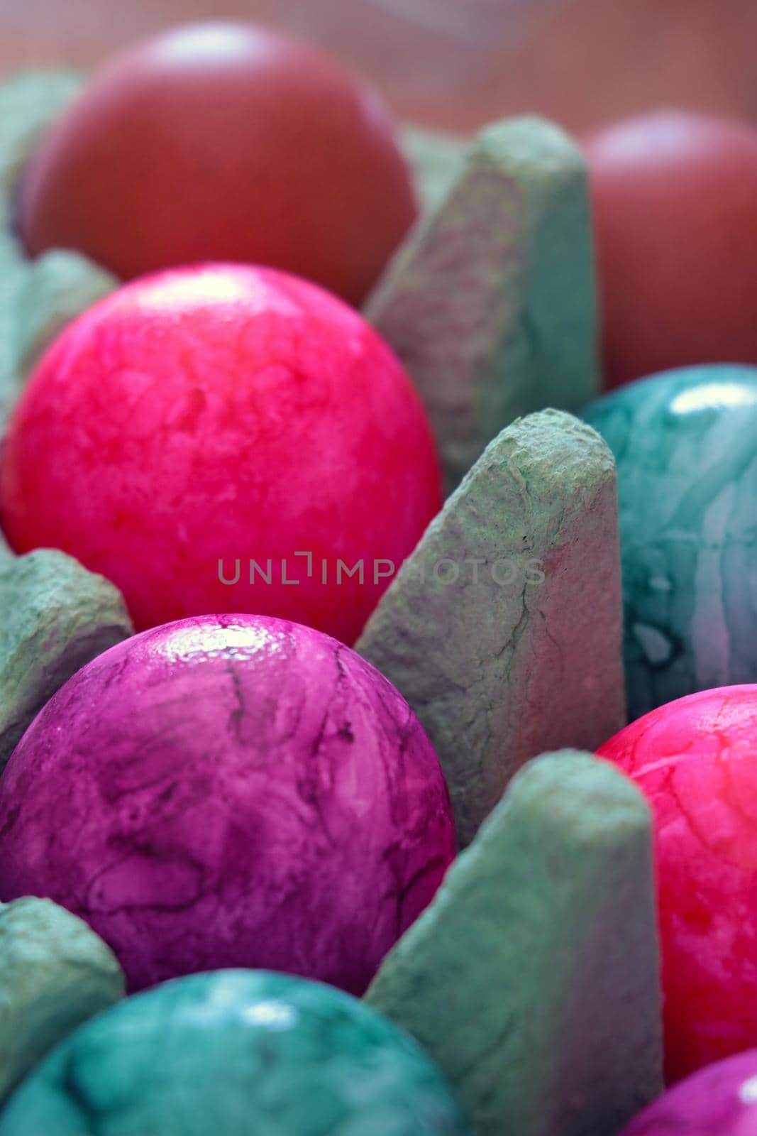 Colorful Easter Eggs in an egg carton. by kip02kas