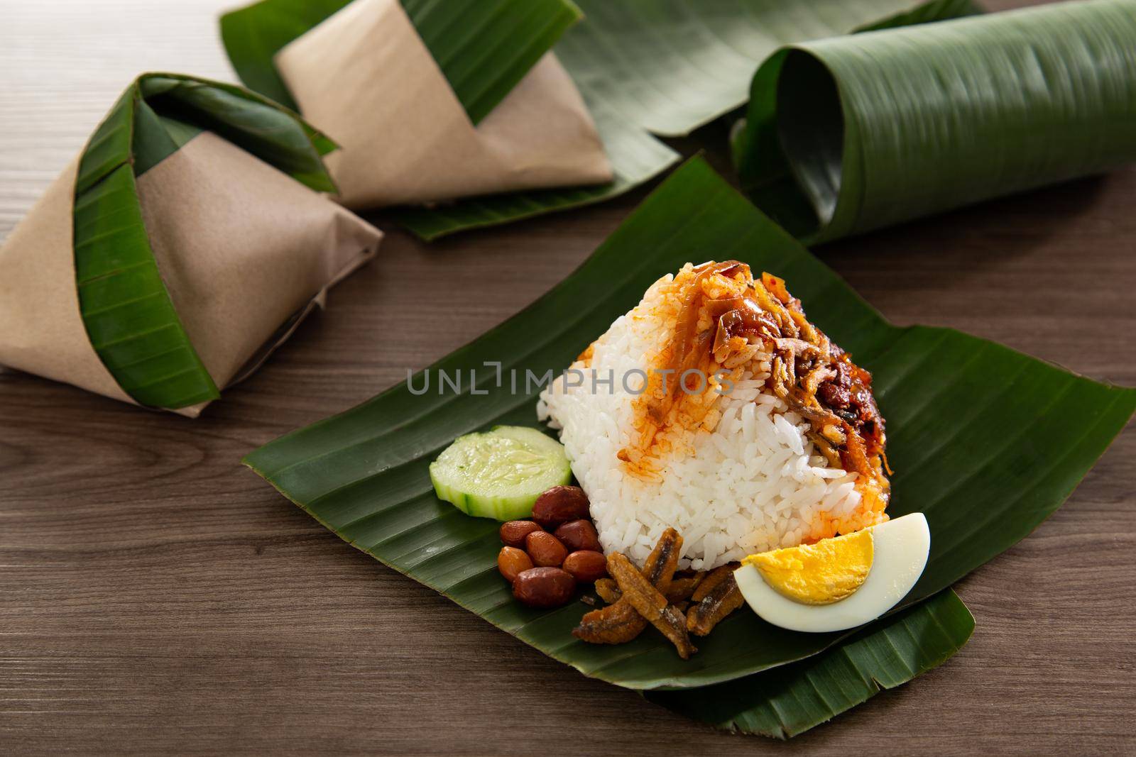 Nasi lemak pack in banana leaf, popular breakfast in Malaysia by tehcheesiong