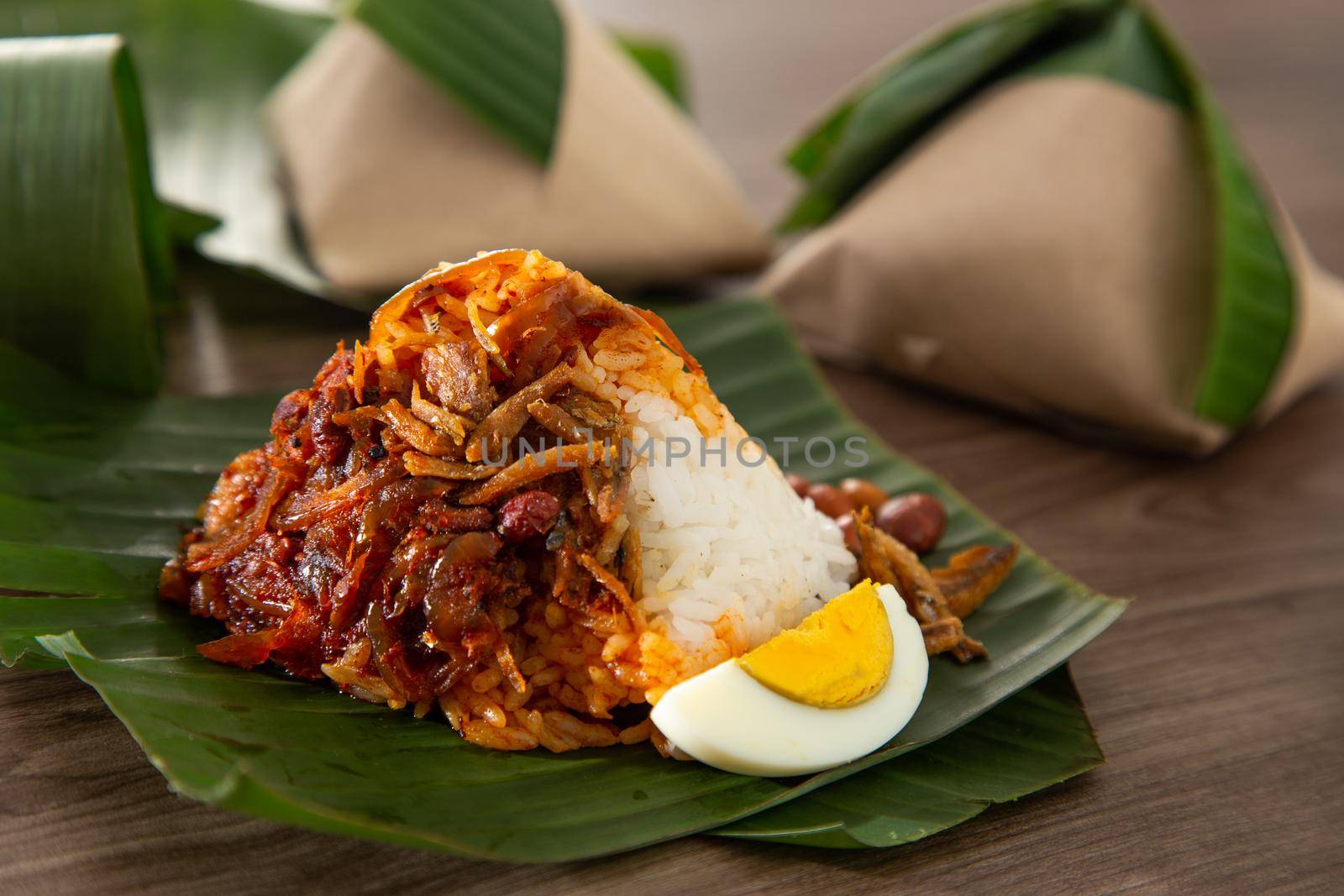 Nasi lemak pack in banana leaf, popular breakfast in Malaysia by tehcheesiong