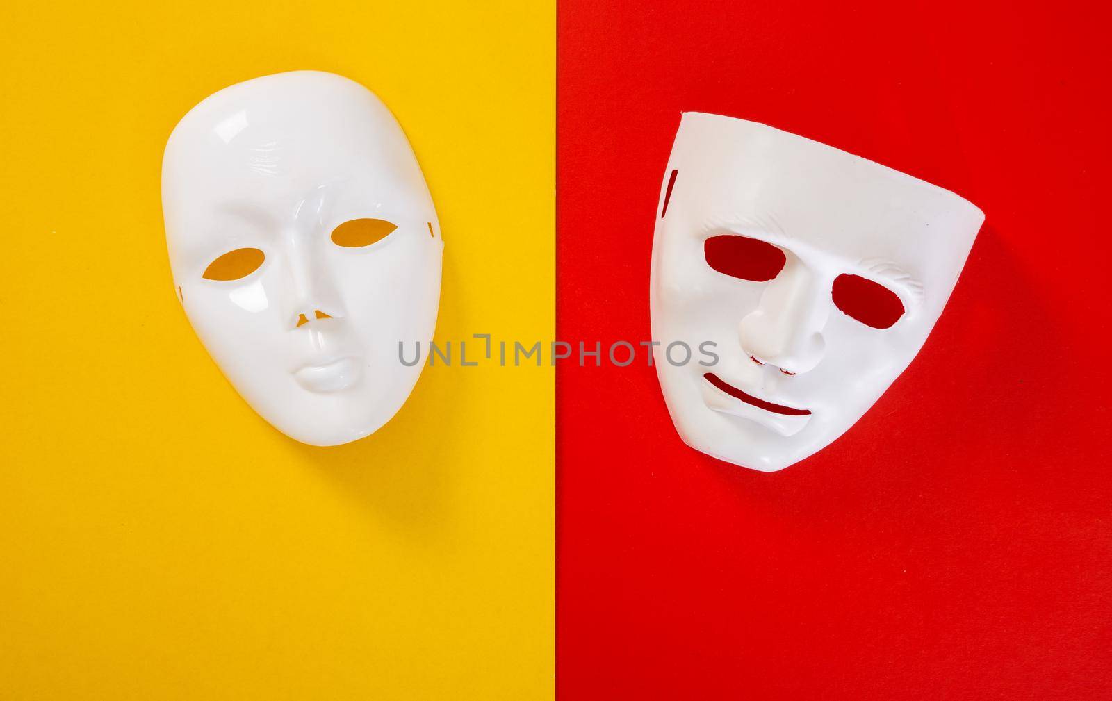 carnival white mask on red and yellow background