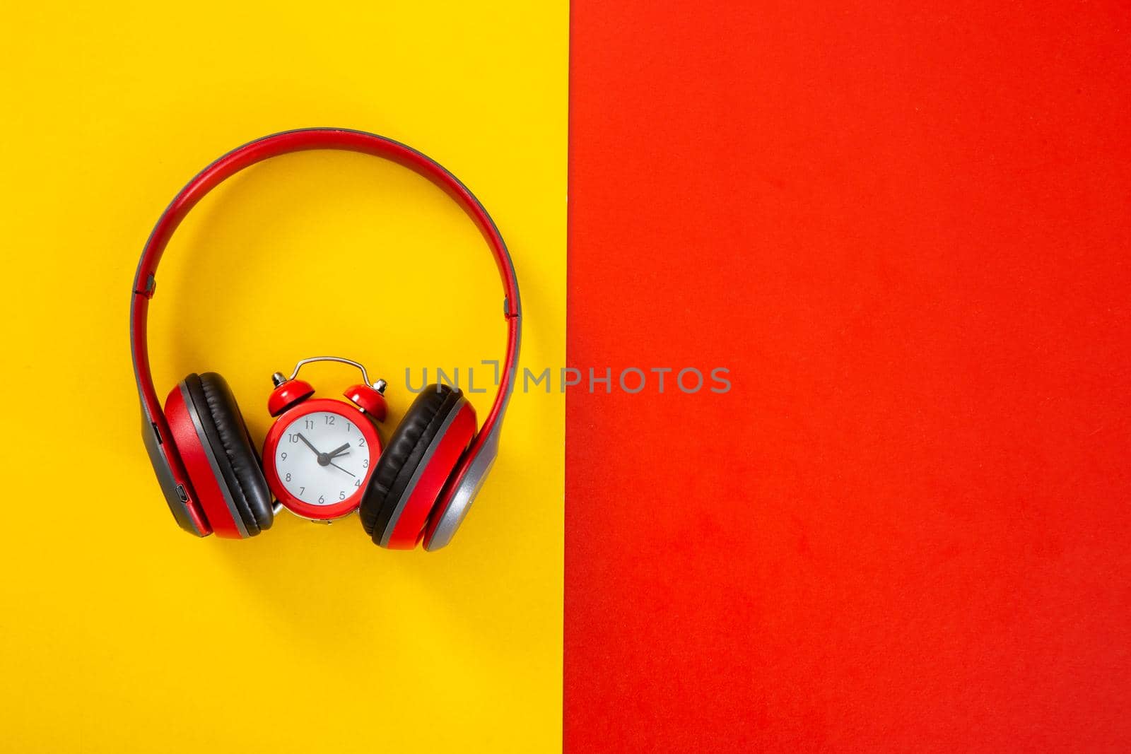 headphones on red and yellow  background. by tehcheesiong