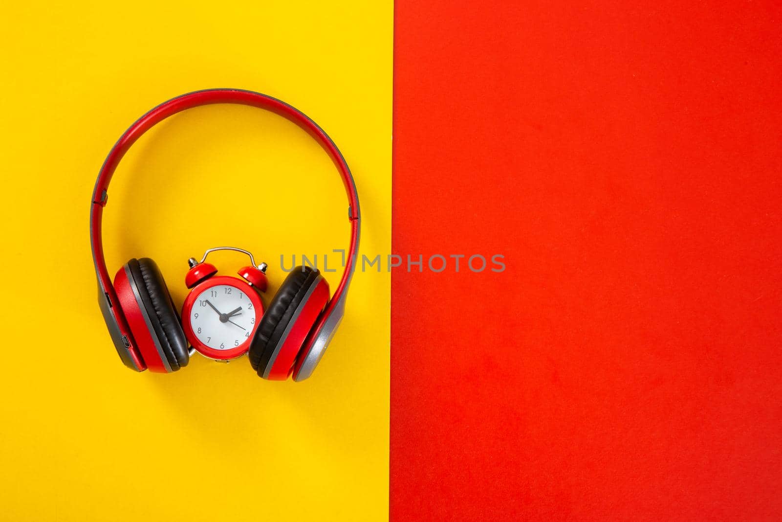 headphones on red and yellow  background. Music concept.