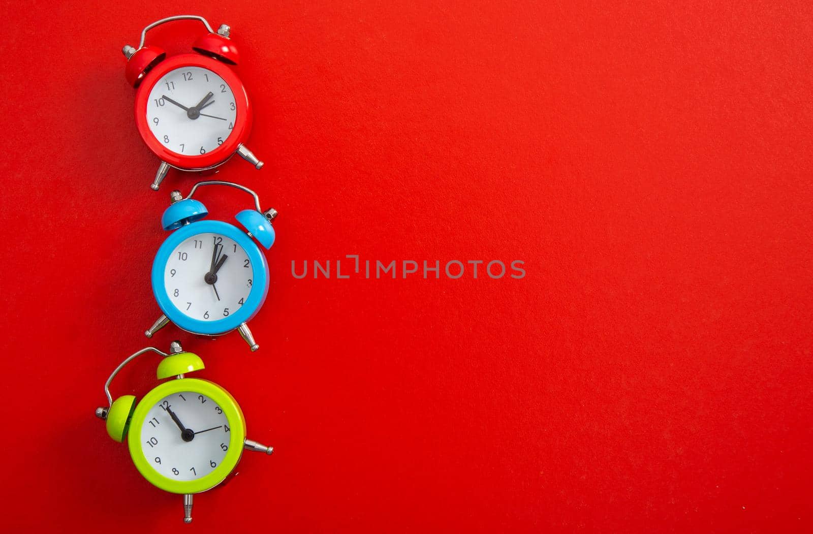 An Alarm clock on a color background.
