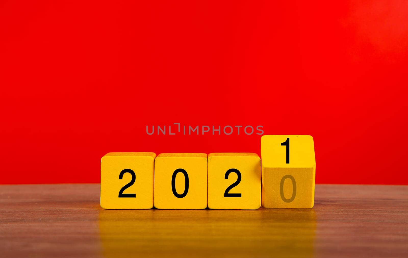 2021 new year background concept. Wooden block with red backgrouind