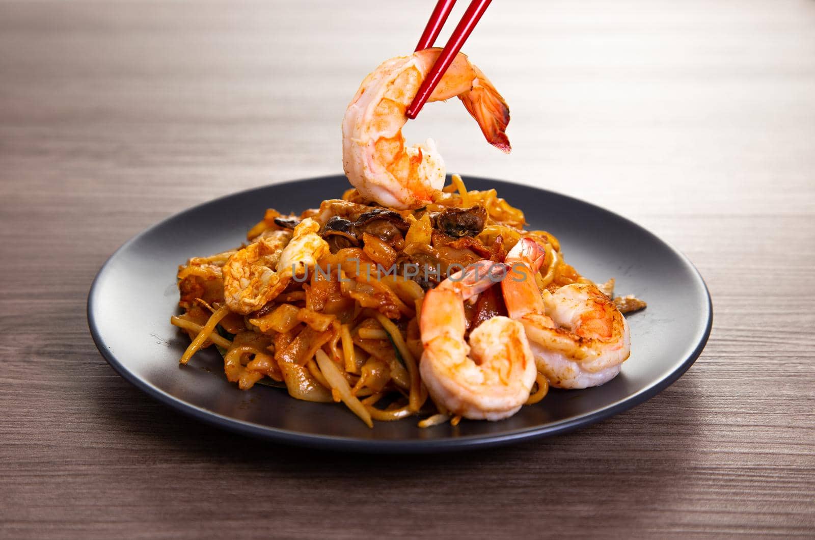 A delicious spicy fried flat rice noodle also know as "char kuew teow" by tehcheesiong
