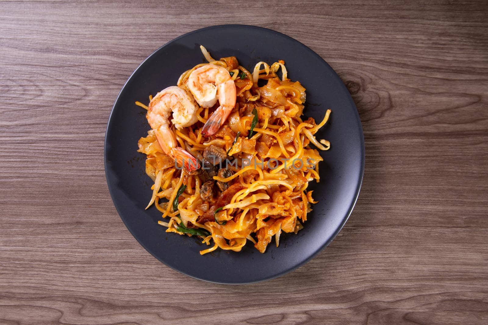 A delicious spicy fried flat rice noodle also know as "char kuew teow" by tehcheesiong