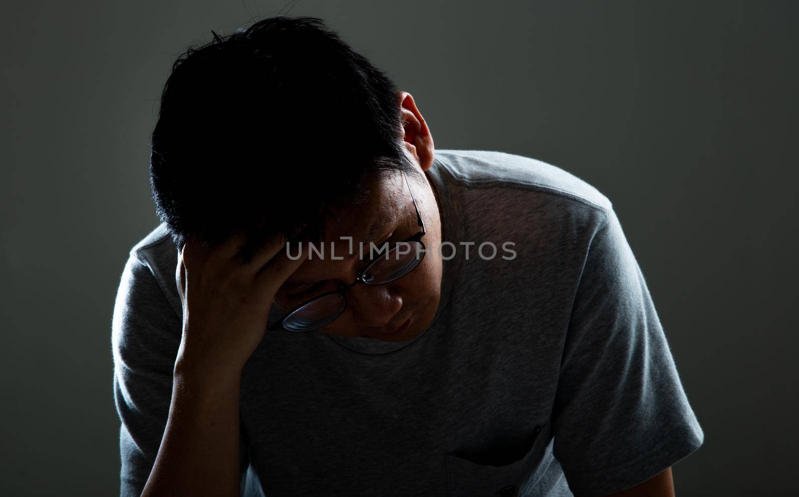 Sad and depressed man thinking of his problem - Feeling depressed background concept