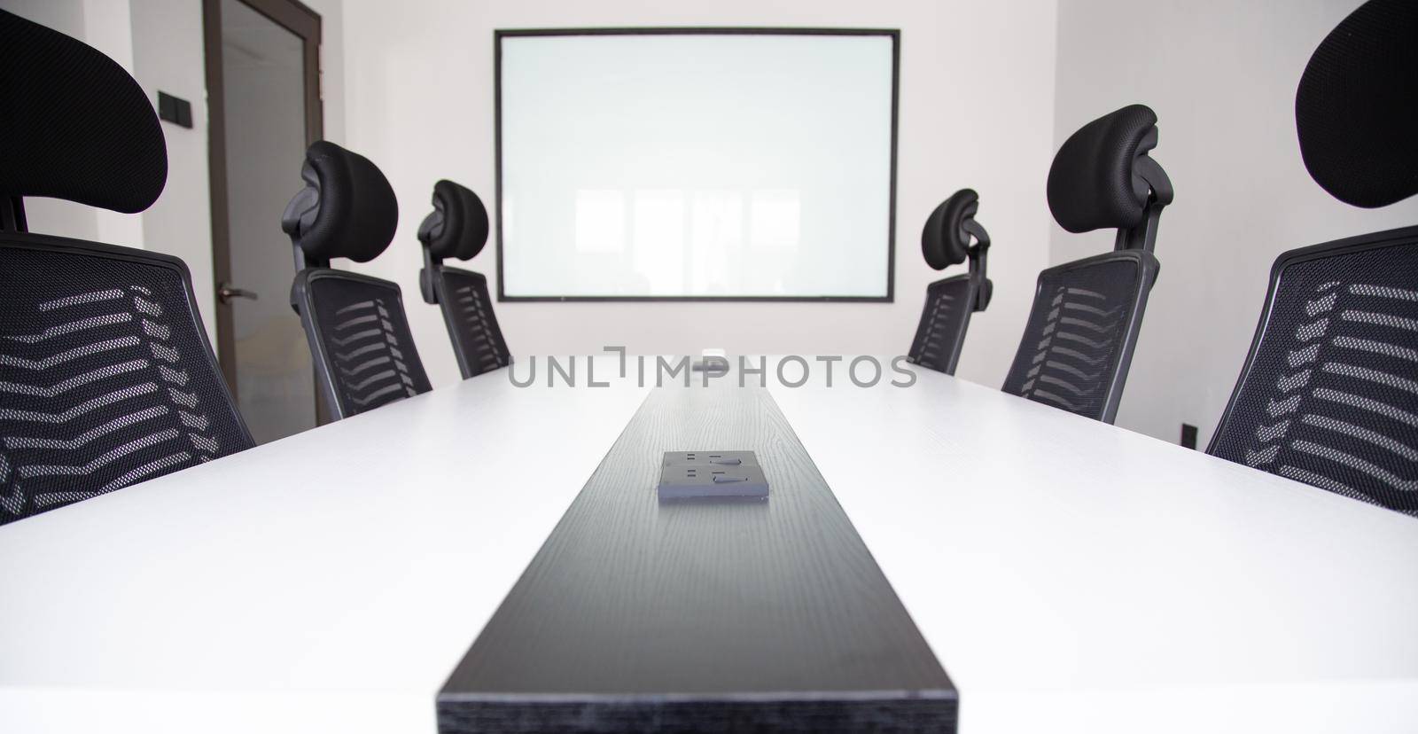 White office interior with furniture and daylight