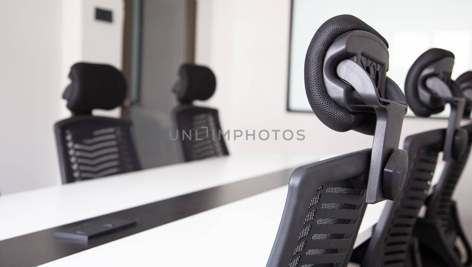 White office interior with furniture and daylight