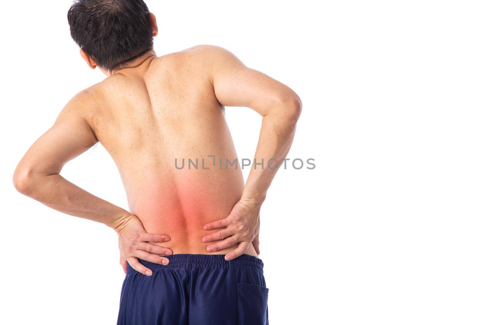 Sore pain of lower back or spine. Sprain and arthritis symptoms. middle age man holding his hurt lower back over white background.