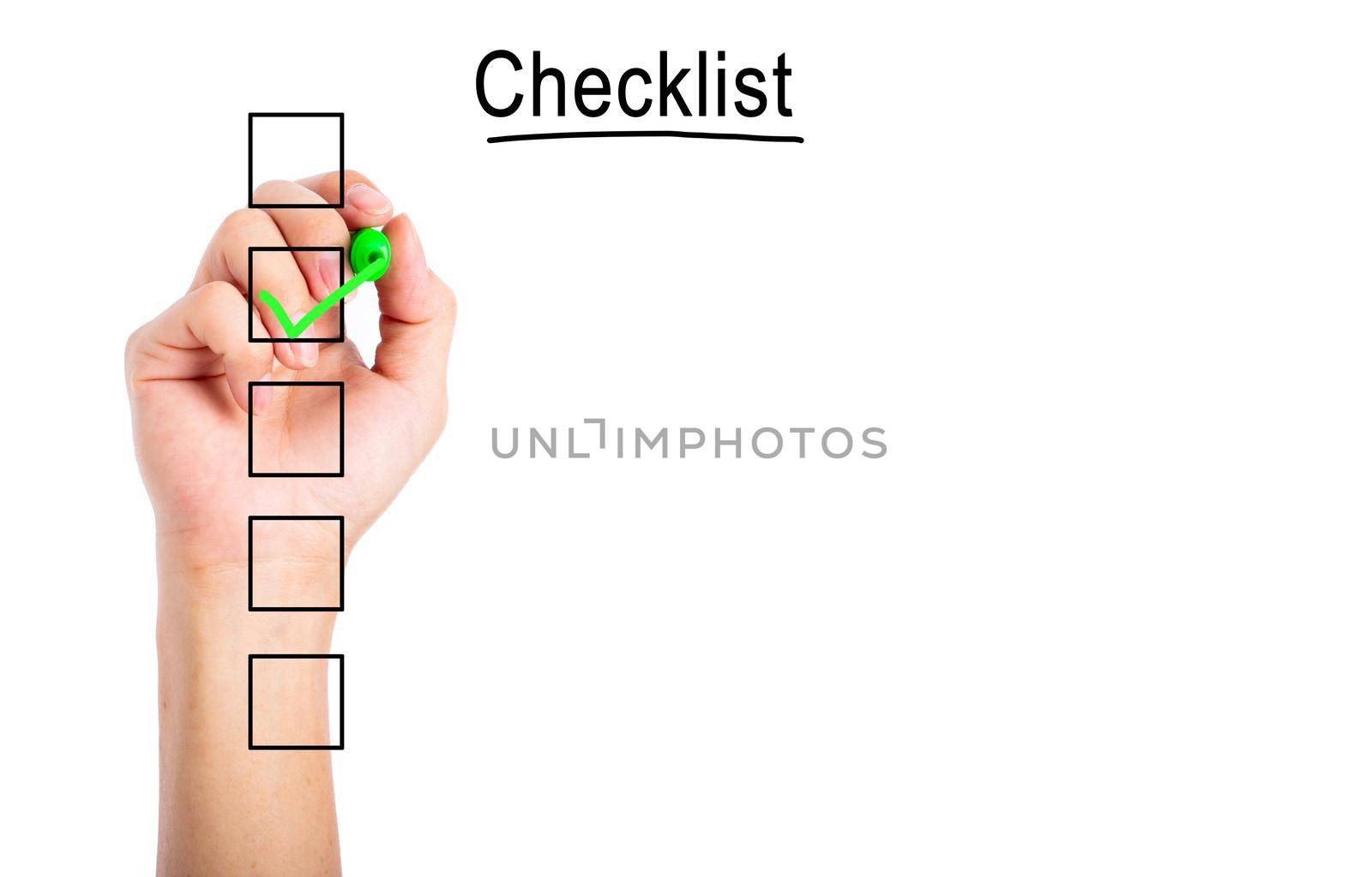 Hand checking mark on checklist with green marker over white